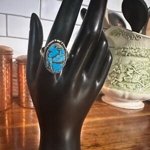 Marked size 10.5 silver and turquoise ring. Hallmark inner rim